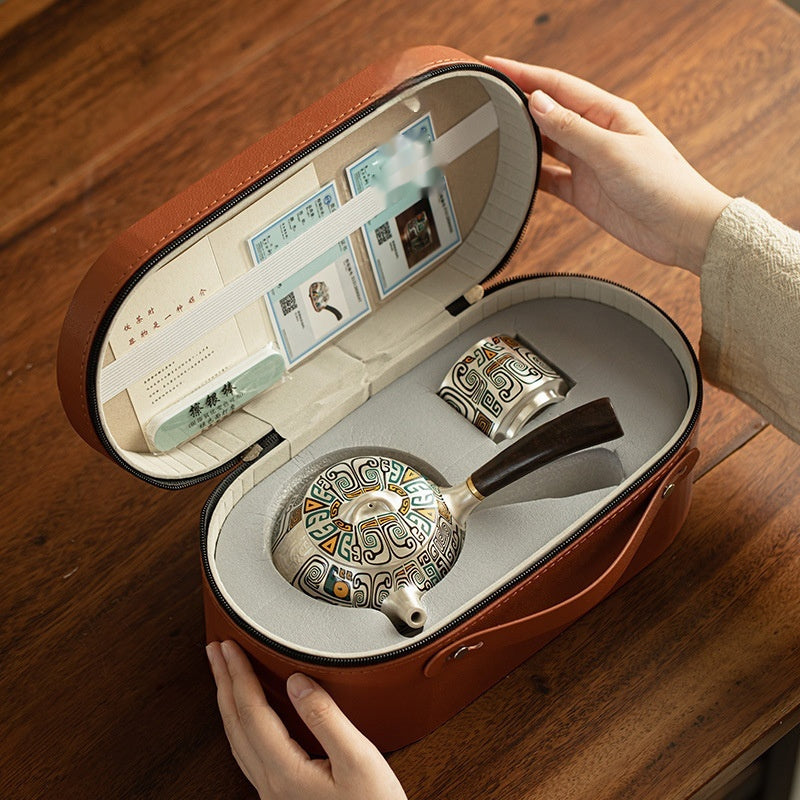 Silver plated tea set in leather case