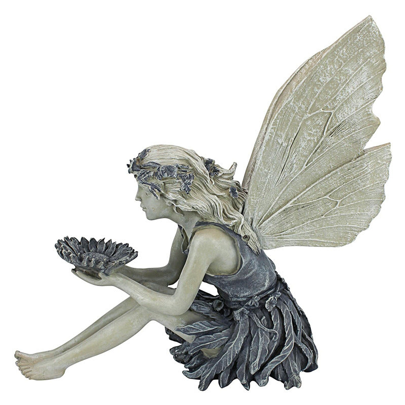 Garden statue sitting angel fairy
