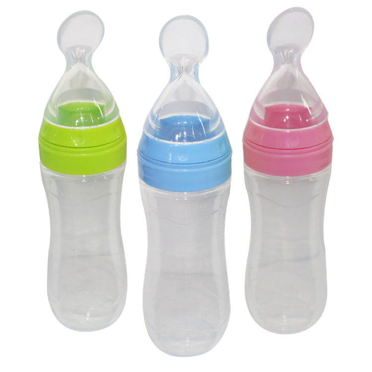 Baby bottle with spoon