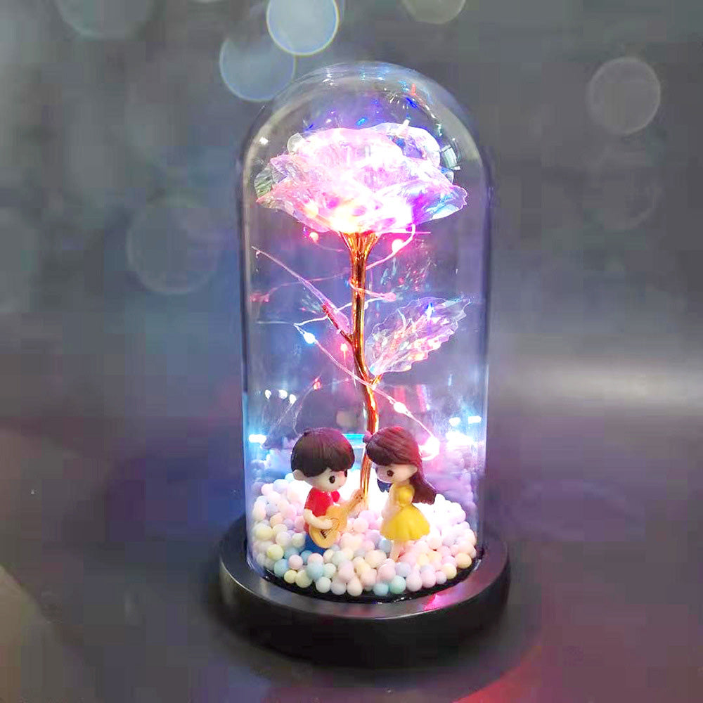 Rose with light in glass cover