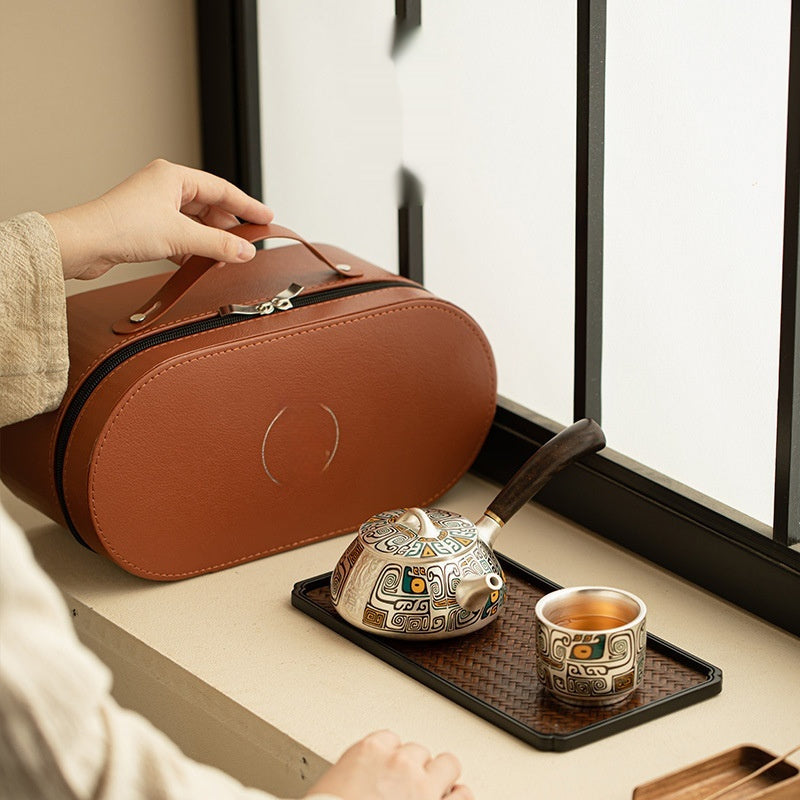 Silver plated tea set in leather case