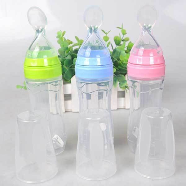 Baby bottle with spoon
