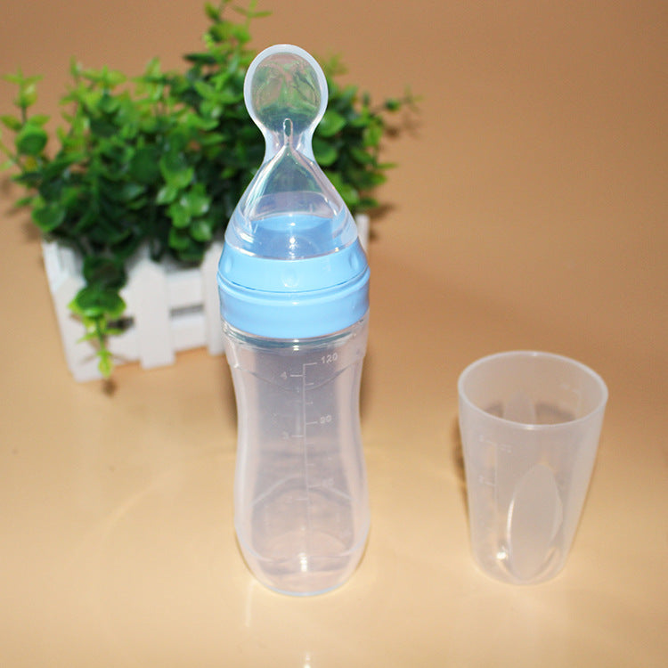 Baby bottle with spoon