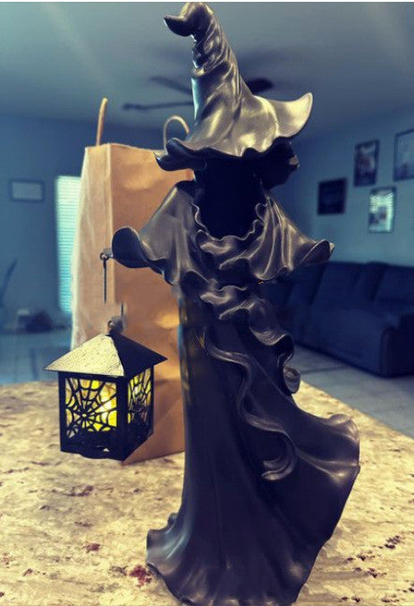 Halloween ghost statue with lantern