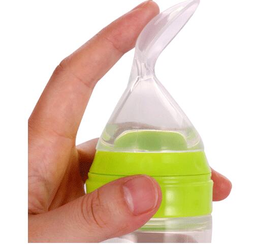 Baby bottle with spoon
