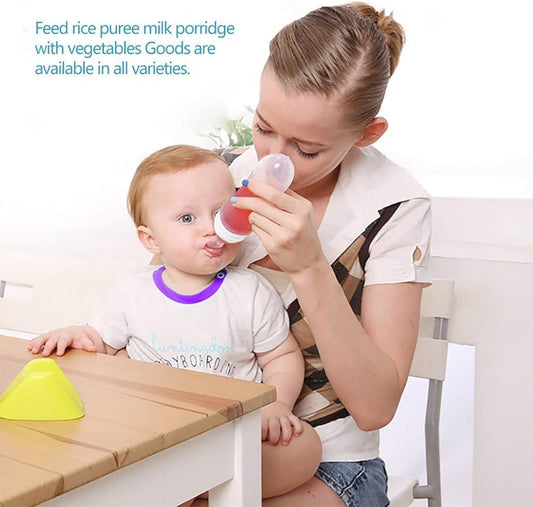 Baby bottle with spoon