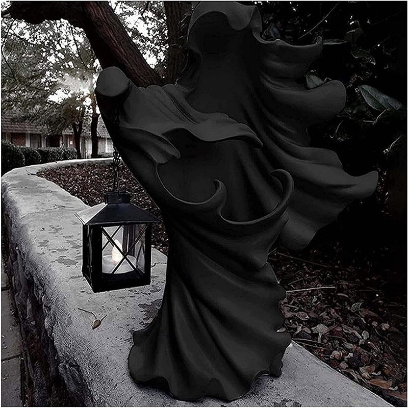 Halloween ghost statue with lantern