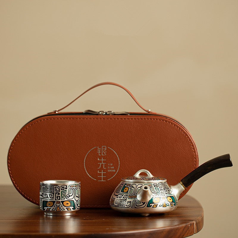 Silver plated tea set in leather case